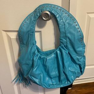 Aldo’s Teal colored hand bag